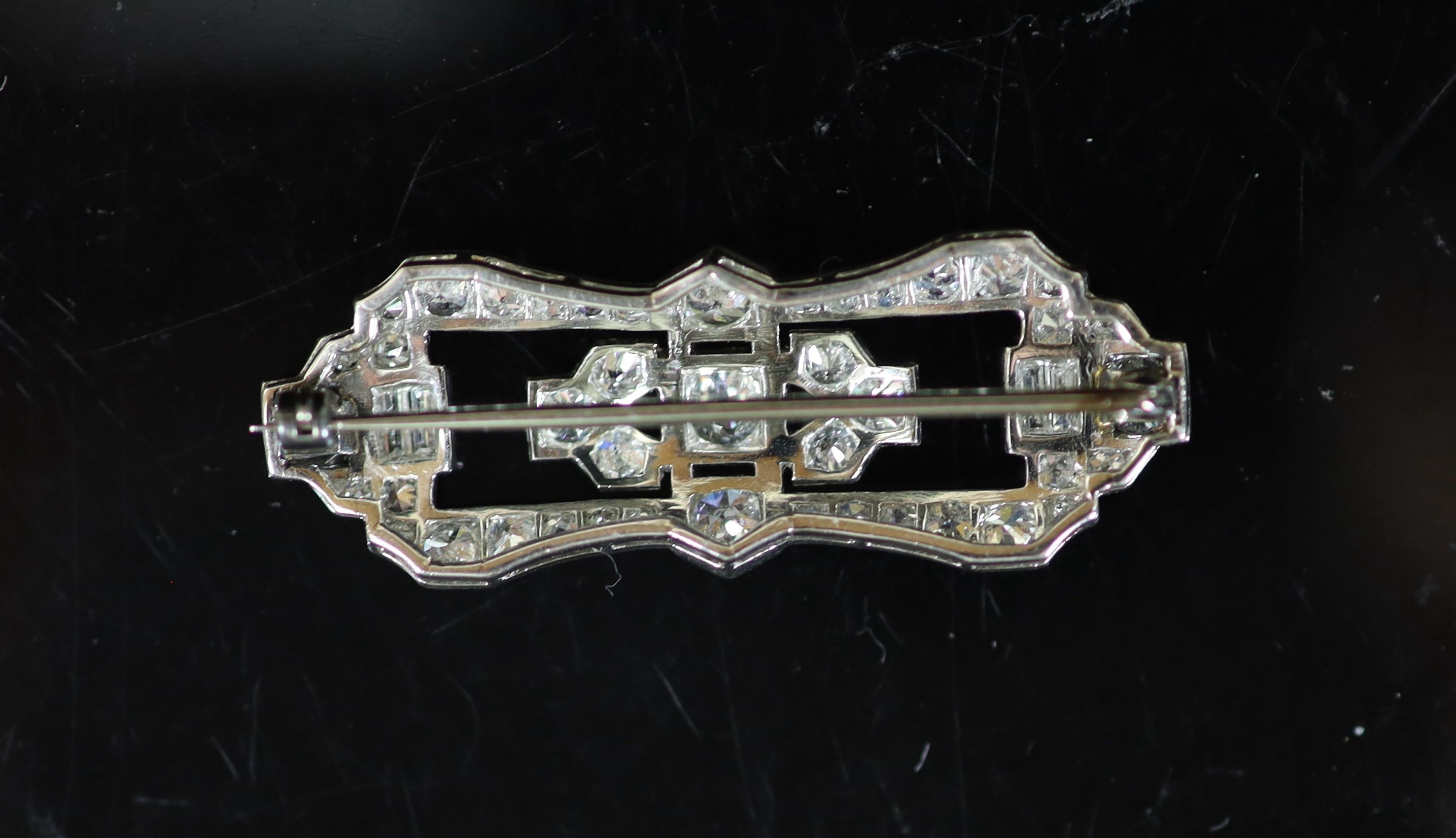 A 1940's/1950's platinum and diamond cluster set open work brooch